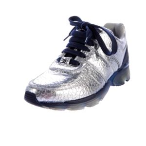 Metallic silver cracked leather Chanel sneakers.
